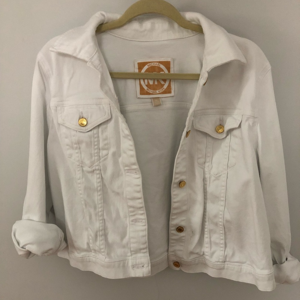 Michael Kors white Jean jacket with gold buttons.